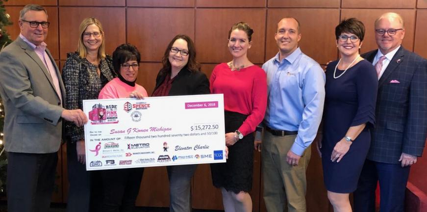 Presenting fundraiser check to Susan G Komen Michigan